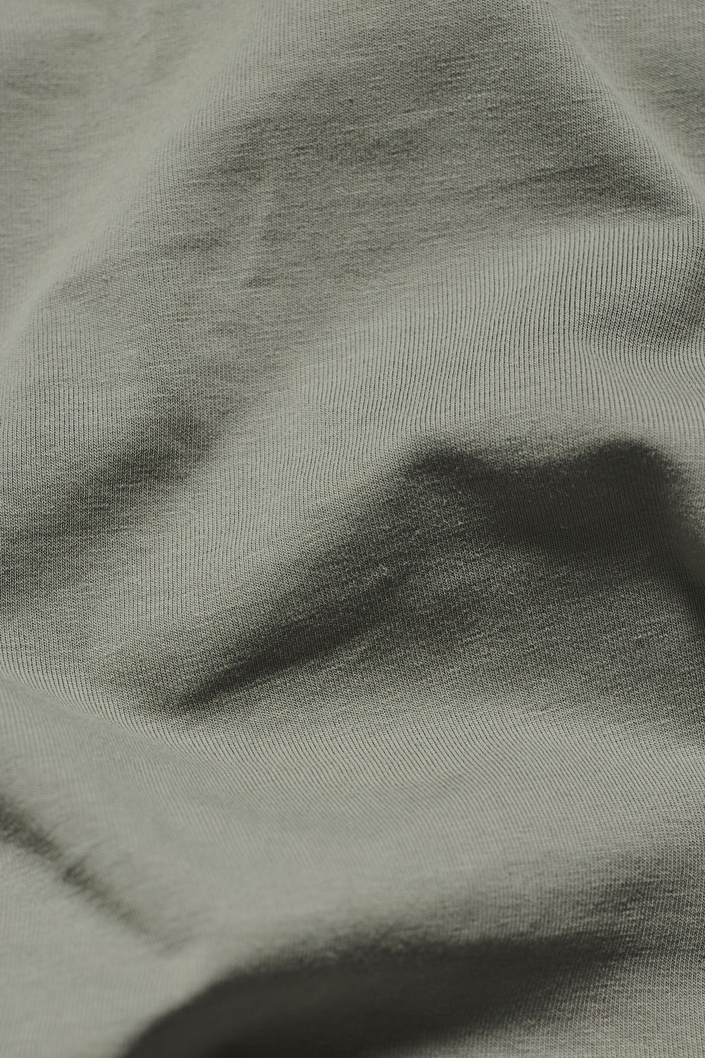 Essential Jersey Buttonless Polo Shirt in Soft Khaki - Image 7