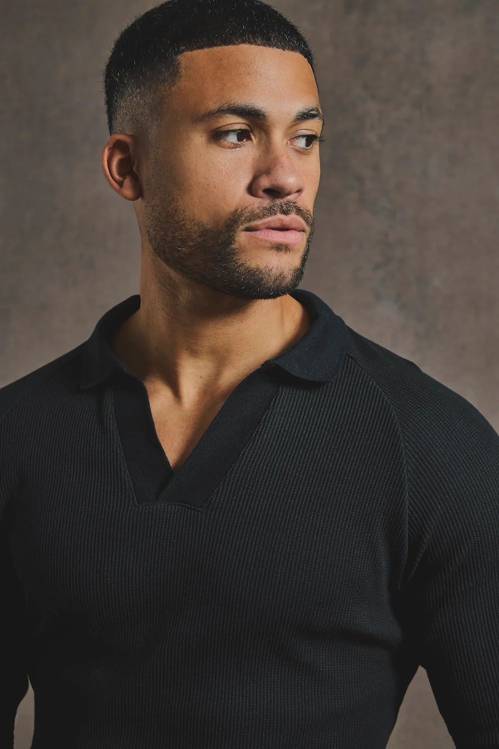 Textured Buttonless Polo Shirt in Black - Image 3